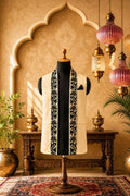Cream Venetian-style jacket with black embroidered front panels on a mannequin