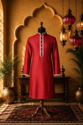 Red long kurta with mandarin collar, central button placket, and contrast trim cuffs