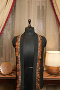 Black fabric fringe drape with rust-orange trim, open front styling