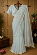 Light blue draped dress with V-neck and lace trim, short sleeves and long sheer overlay